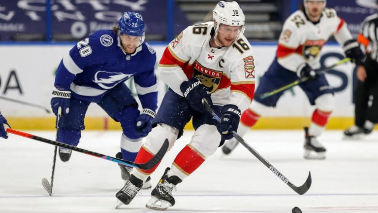 Florida Panthers' Aleksander Barkov (16), of Finland, brings the puck upice as he is pursued by Tampa Bay Lightning's Blake Coleman during the first period of an NHL hockey game Monday, Feb. 15, 2021, in Tampa, Fla. (Mike Carlson/AP)