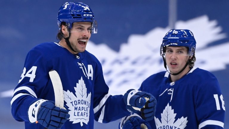 Toronto Maple Leafs centre Auston Matthews (34) celebrates his power play goal with teammate Mitch Marner (16). (Nathan Denette/CP)