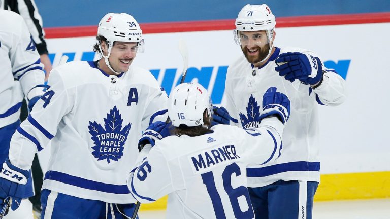 Toronto Maple Leafs stars Auston Matthews (34), Mitchell Marner (16) and Nick Foligno (71) celebrate Matthews' goal against the Winnipeg Jets. (John Woods/CP)