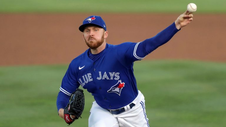 Toronto Blue Jays pitcher Travis Bergen throws against the Atlanta Braves. (Mike Carlson/AP)