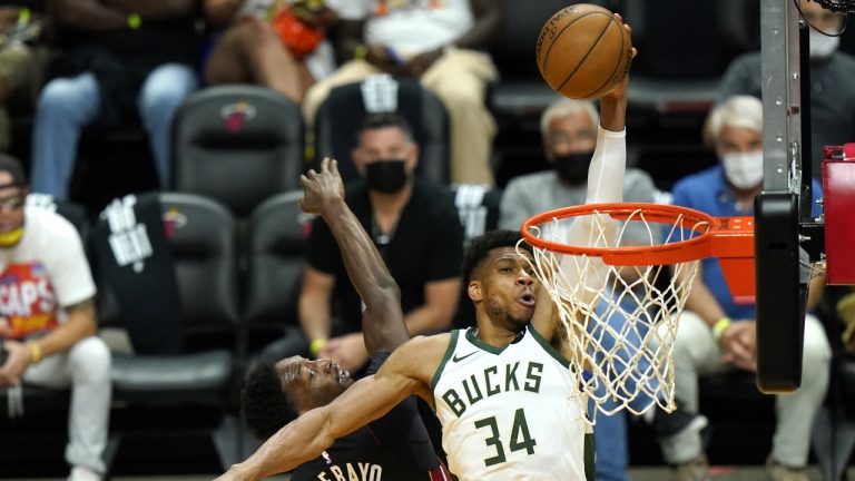 Milwaukee Bucks forward Giannis Antetokounmpo (34) shoots as Miami Heat center Bam Adebayo (13) defends during the second half of Game 4 of an NBA basketball first-round playoff series, Saturday, May 29, 2021, in Miami. (Lynne Sladky/AP)