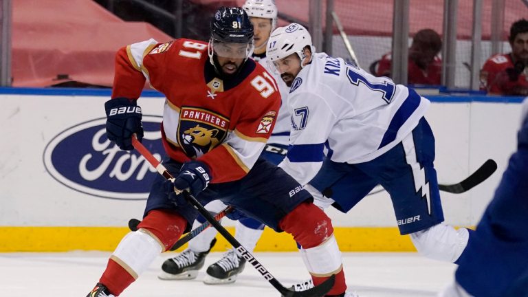 Florida Panthers left wing Anthony Duclair (91) controls the puck as Tampa Bay Lightning left wing Alex Killorn (17) defends during the second period of an NHL hockey game, Monday, May 10, 2021, in Sunrise, Fla. (AP Photo/Lynne Sladky)