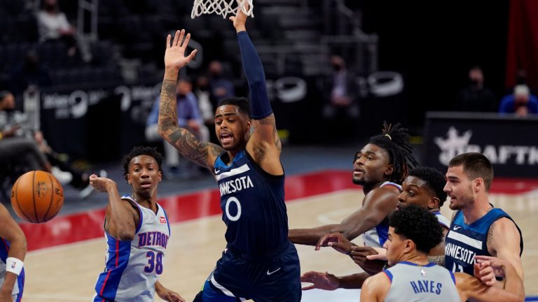 Minnesota Timberwolves guard D'Angelo Russell (0) loses control of the ball during the first half of an NBA basketball game against the Detroit Pistons, Tuesday, May 11, 2021, in Detroit. (AP Photo/Carlos Osorio)