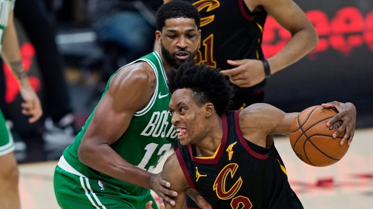 Cleveland Cavaliers' Collin Sexton (2) drives against Boston Celtics' Tristan Thompson (13) during the second half of an NBA basketball game Wednesday, May 12, 2021, in Cleveland. (AP Photo/Tony Dejak)