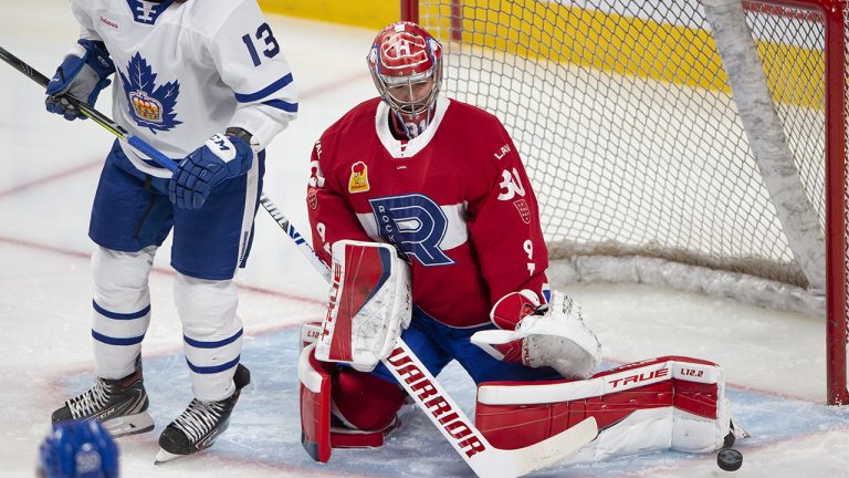 Goaltender Carey Price makes a save for the Laval Rocket as Toronto Marlies' Stefan Noesen looks for the rebound during first period American Hockey League action in Montreal, Monday, May 17, 2021. (Ryan Remiorz/CP)