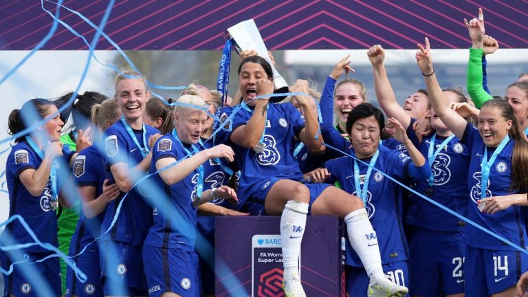 Chelsea's Samantha Kerr, centre, celebrates with teammates as they hold the FA Women's Super League trophy. (John Walton/PA via AP)