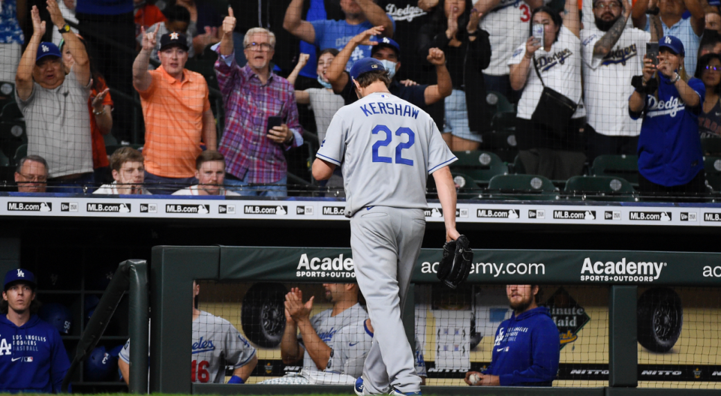 Dodger ace pitcher Clayton Kershaw returns to the dugout with