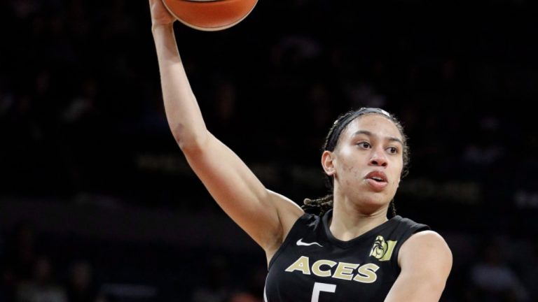 Las Vegas Aces forward Dearica Hamby, right, passes the ball as Phoenix Mercury guard Diana Taurasi defends during the second half of a WNBA basketball game, Wednesday, Aug. 1, 2018, in Las Vegas. (John Locher/AP)