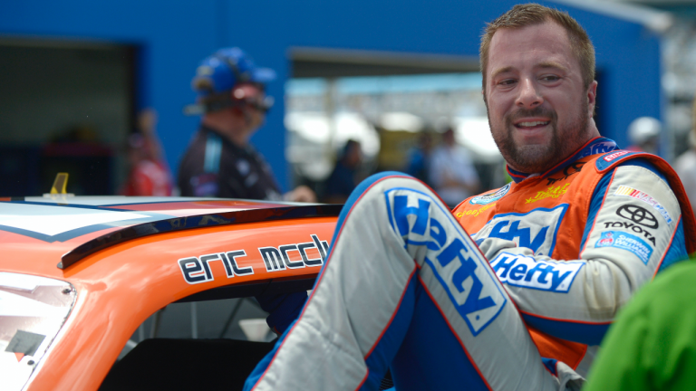 In this July 5, 2013 file photo, Eric McClure gets out of his car after finishing his laps during qualifying for a NASCAR Nationwide auto race at Daytona International Speedway in Daytona Beach, Fla. Former NASCAR driver McClure died Sunday, May 2, 2021, his family and the series said. (Phelan M. Ebenhack / AP)