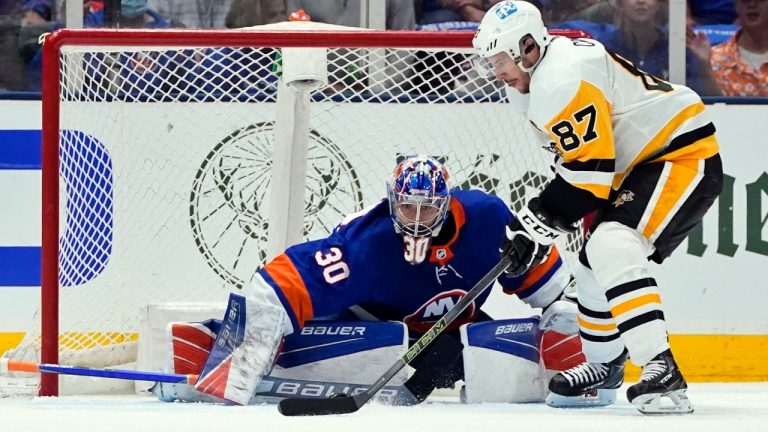 New York Islanders goaltender Ilya Sorokin (30) protects the net from Pittsburgh Penguins' Sidney Crosby (87) during the second period of Game 4 of an NHL hockey Stanley Cup first-round playoff series, Saturday, May 22, 2021, in Uniondale, N.Y. (Frank Franklin II/AP)