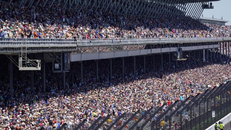 Fans fill the stands during the Indianapolis 500 auto race at Indianapolis Motor Speedway in Indianapolis, Sunday, May 30, 2021. About 135,000 spectators are admitted to the track, for the largest sports event since the start of the pandemic. It's about 40% of attendance and leaves 100,000 empty seats in the permanent grandstands. (Paul Sancya/AP)