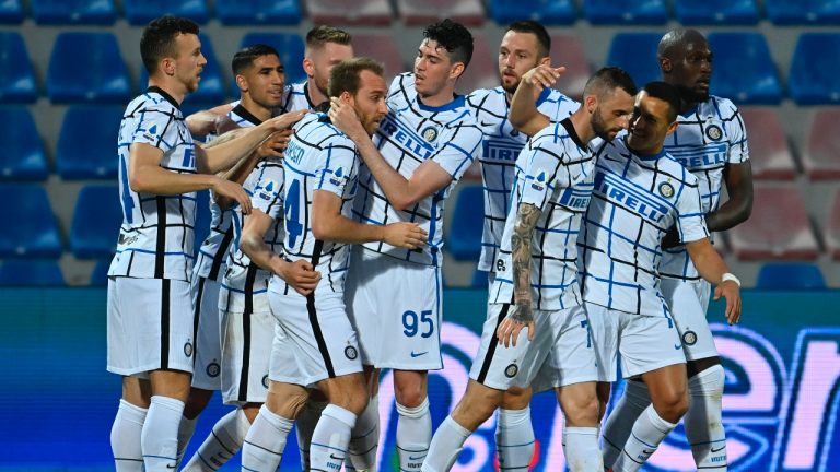 Inter Milan's Christian Eriksen, fourth form left, celebrates after scoring his side's first goal during the Italian Serie A soccer match between Crotone and Inter Milan at the Ezio Scida Stadium in Crotone, Italy, Saturday, May 1, 2021. (Francesco Mazzitello/LaPresse Via AP)