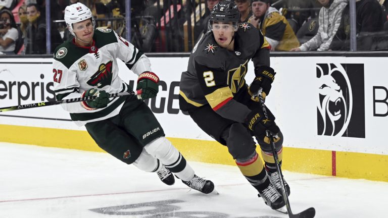 Minnesota Wild center Nick Bjugstad (27) and Vegas Golden Knights defenceman Zach Whitecloud (2). (David Becker/AP)