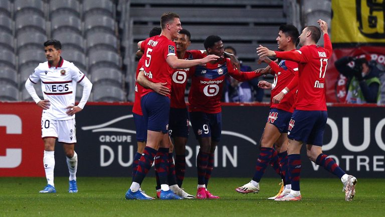 Lille 's players react after scoring the second goal during their French League One soccer match between Lille and Nice in Villeneuve d'Ascq, northern France, Saturday May. 1, 2021. (AP Photo/Michel Spingler)