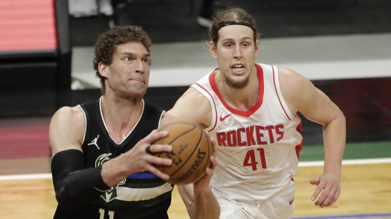 Milwaukee Bucks' Brook Lopez (11) drives to the basket against Houston Rockets' Kelly Olynyk (41) during the second half of an NBA basketball game Friday, May 7, 2021, in Milwaukee. (Aaron Gash/AP)