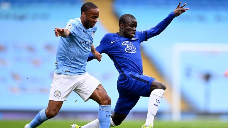 Manchester City's Raheem Sterling, left, and Chelsea's N'Golo Kante challenge for the ball during the English Premier League soccer match between Manchester City and Chelsea at the Etihad Stadium in Manchester, Saturday, May 8, 2021.(Laurence Griffiths/Pool via AP)