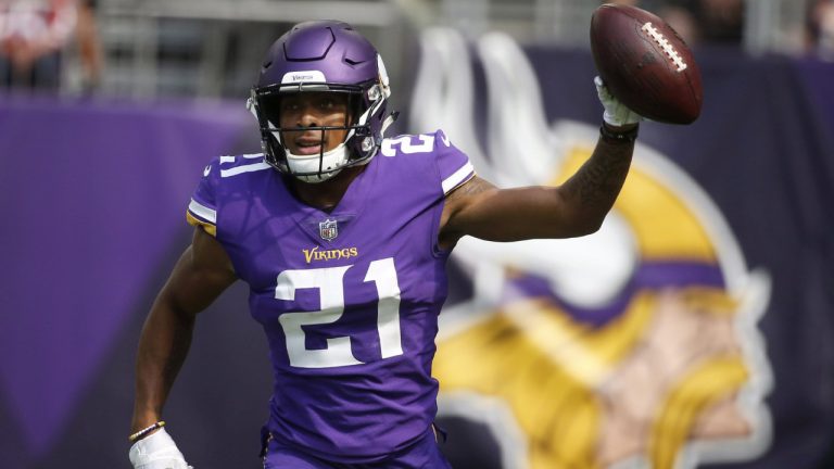 Former Minnesota Vikings cornerback Mike Hughes celebrates after returning an interception 28-yards for a touchdown. (Bruce Kluckhohn/AP)