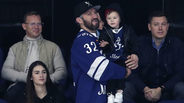 Alexander Ovechkin with wife Anastasia Shubskaya and son watch a KHL game. (Sergei Savostyanov/TASS)