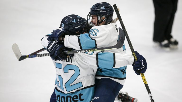 Team Sonnet Ella Shelton, left, celebrates a goal with teammate Loren Gabel during first period PWHPA Dream Tour hockey action. (Jeff McIntosh/CP)