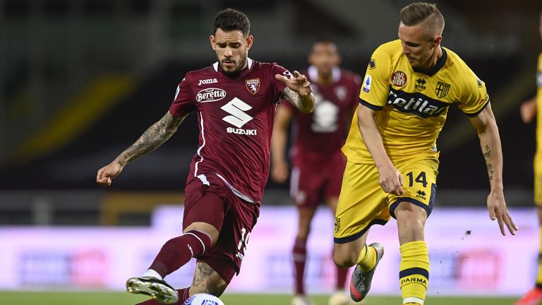 Antonio Sanabria, left, of Torino controls the ball during the Italian Serie A soccer match between Torino and Parma. Monday, May 3, 2021. (Fabio Ferrari/LaPresse via AP)