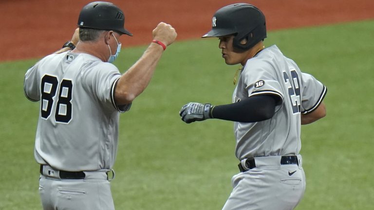 New York Yankees' Gio Urshela, right, celebrates his two-run home run off Tampa Bay Rays starting pitcher Michael Wacha with third base coach Phil Nevin during the third inning of a baseball game. (Chris O'Meara/AP)