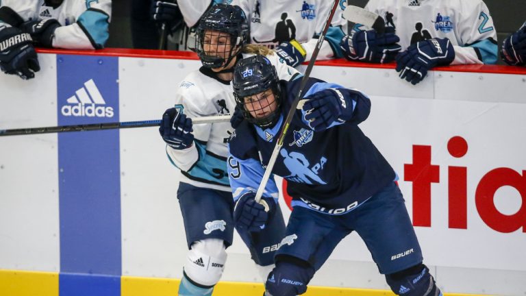 Team Bauer Marie-Philip Poulin, right, checks Team Sonnet Nicole Kosta during first period PWHPA Dream Tour hockey action in Calgary, Monday, May 24, 2021. (Jeff McIntosh/CP)