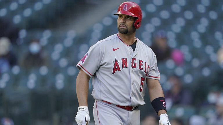 Former Los Angeles Angels slugger Albert Pujols walks to the dugout after he was called out on strikes during the ninth inning of a baseball game against the Seattle Mariners.  (Ted S. Warren/AP)