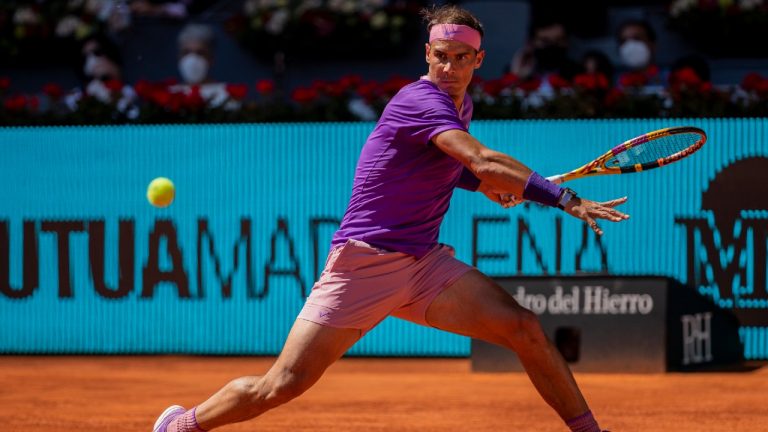 Spain's Rafael Nadal returns the ball to Spain's Carlos Alcaraz during their match at the Mutua Madrid Open tennis tournament in Madrid, Spain, Wednesday, May 5, 2021. (Bernat Armangue/AP)