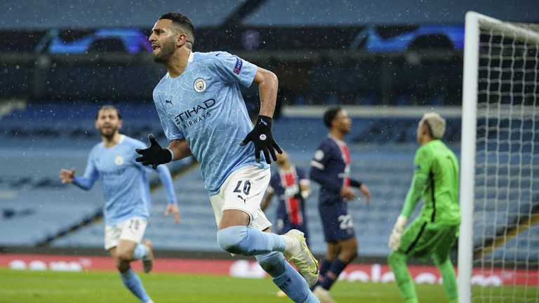 Manchester City's Riyad Mahrez celebrates after scoring his sides second goal during the Champions League semifinal second leg soccer match between Manchester City and Paris Saint Germain, Tuesday, May 4, 2021. (AP)