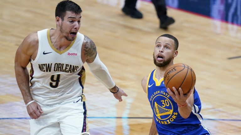 Golden State Warriors guard Stephen Curry (30) goes to the basket against New Orleans Pelicans center Willy Hernangomez (9) in the first half of an NBA basketball game in New Orleans, Monday, May 3, 2021. (Gerald Herbert/AP)