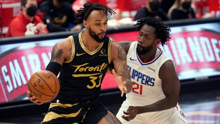 Toronto Raptors guard Gary Trent Jr. (33) tries to work around Los Angeles Clippers guard Patrick Beverley (21) during the first half of an NBA basketball game Tuesday, May 11, 2021, in Tampa, Fla. (Chris O'Meara/AP)