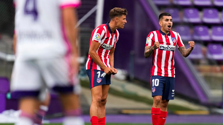 Atletico Madrid's Angel Correa, right, celebrates with teammate Marcos Llorente after scoring his side's first goal during the Spanish La Liga soccer match between Atletico Madrid and Valladolid at the Jose Zorrilla stadium in Valladolid, Spain, Saturday, May 22, 2021. (Manu Fernandez/AP)