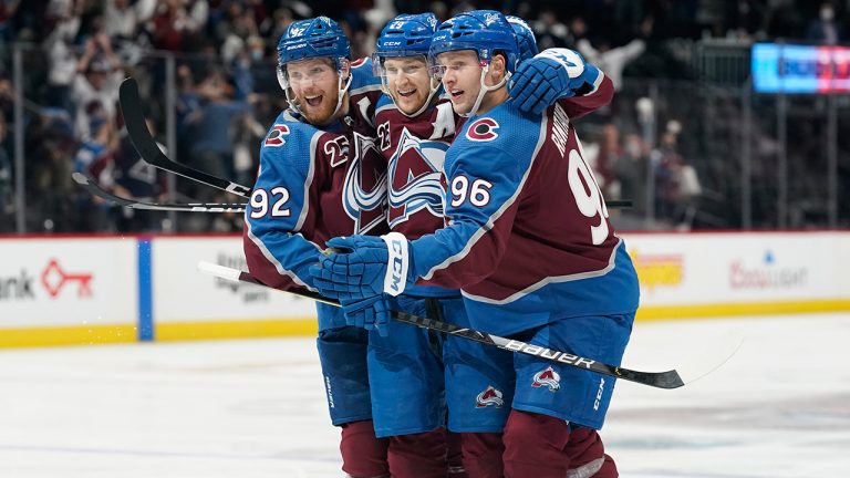 Colorado Avalanche left wing Gabriel Landeskog, centre Nathan MacKinnon and right wing Mikko Rantanen, from left, celebrate a goal against the St. Louis Blues in the second period of Game 2 of their Stanley Cup first-round playoff series Wednesday, May 19, 2021, in Denver. (David Zalubowski/AP) 