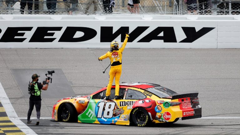 Kyle Busch, center, reacts after winning a NASCAR Cup Series auto race at Kansas Speedway in Kansas City, Kan., Sunday, May 2, 2021. (Colin E. Braley/AP)