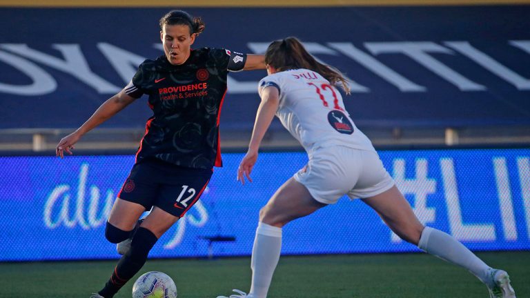 Washington Spirit midfielder Andi Sullivan, right, defends against Portland Thorns forward Christine Sinclair during the first half of an NWSL Challenge Cup soccer match at Zions Bank Stadium on Sunday, July 5, 2020, in Herriman, Utah. (Rick Bowmer/AP)