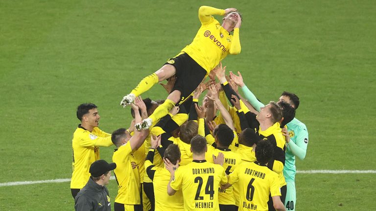 Dortmund players celebrate at the end of the DFB Pokal final match between RB Leipzig and Borussia Dortmund in Berlin, Germany, Thursday, May 13, 2021. (Maja Hitij/Pool via AP)