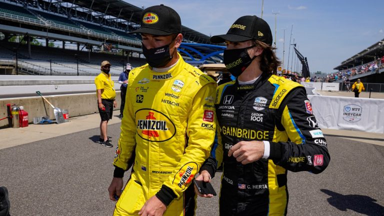 Scott McLaughlin, left, of New Zealand, and Colton Herta walk out of the pit area during practice for the Indianapolis 500 auto race at Indianapolis Motor Speedway in Indianapolis, Thursday, May 20, 2021. (Michael Conroy/AP)