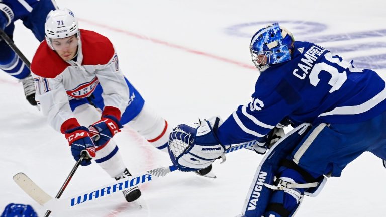 Toronto Maple Leafs goaltender Jack Campbell (36) reaches for the puck with Montreal Canadiens forward Jake Evans (71) during first period NHL Stanley Cup playoff action in Toronto on Thursday, May 20, 2021. (Frank Gunn/CP)