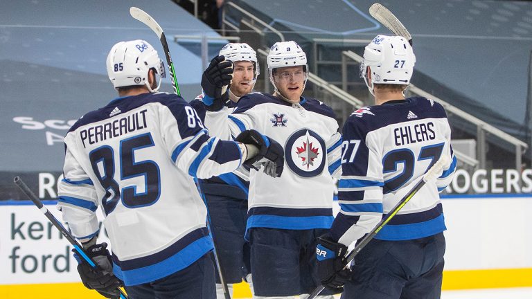 Winnipeg Jets' Mathieu Perreault (85), Pierre-Luc Dubois (13), Andrew Copp (9) and Nikolaj Ehlers (27) celebrate a goal against the Edmonton Oilers during first period NHL action in Edmonton on Saturday, March 20, 2021. (Jason Franson/CP)