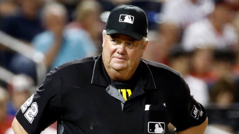 In this Sept. 27, 2019, file photo, umpire Joe West stands on the field during a baseball game between the Cleveland Indians and the Washington Nationals in Washington. (Patrick Semansky/AP) 