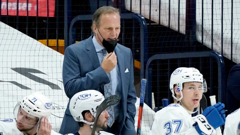 Tampa Bay Lightning head coach Jon Cooper talks with his players in the third period of an NHL hockey game against the Nashville Predators Saturday, April 10, 2021, in Nashville, Tenn. Tampa Bay won 3-0. (Mark Humphrey/AP)