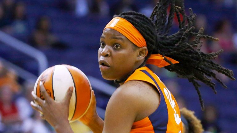 Connecticut Sun forward Jonquel Jones grabs a rebound against the Phoenix Mercury during the second half of a WNBA basketball game in Phoenix. (Ross D. Franklin/AP)