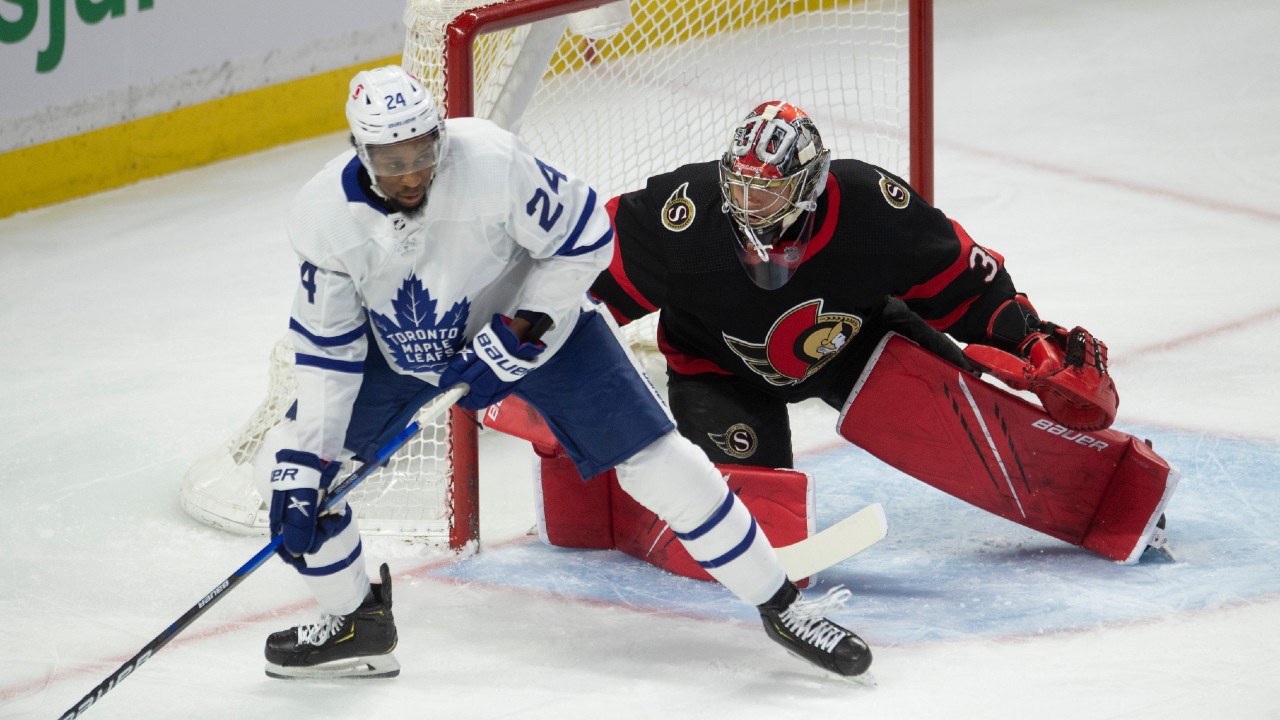 Officials separate Toronto Maple Leafs forward Wayne Simmonds (24