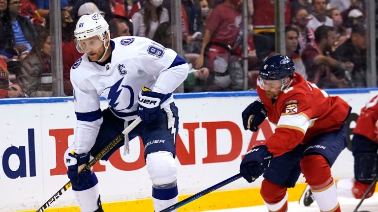 Tampa Bay Lightning center Steven Stamkos (91) skates with the puck as Florida Panthers defenseman Anton Stralman (6) gives chase during the first period in Game 5 of an NHL hockey Stanley Cup first-round playoff series, Monday, May 24, 2021, in Sunrise, Fla. (Lynne Sladky/AP) 