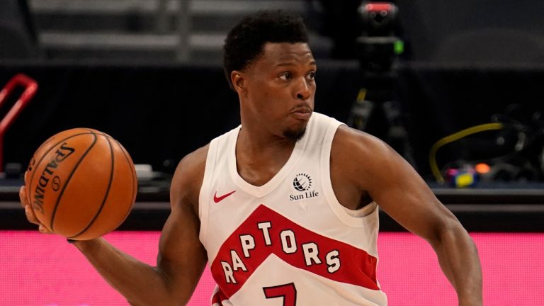 Toronto Raptors guard Kyle Lowry (7) moves the ball against the Denver Nuggets during the second half of an NBA basketball game Wednesday, March 24, 2021, in Tampa, Fla. (Chris O'Meara/AP)