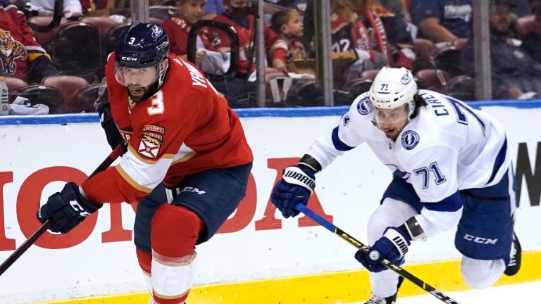 Florida Panthers defenseman Keith Yandle (3) and Tampa Bay Lightning center Anthony Cirelli (71) chase the puck during the first period in Game 2 of an NHL hockey Stanley Cup first-round playoff series Tuesday, May 18, 2021, in Sunrise, Fla. (Lynne Sladky/AP)