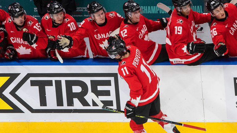 Canada's Cole Perfetti (11) celebrates his goal with teammates against Russia during first period IIHF World Junior Hockey Championship action in Edmonton on Monday, January 4, 2021. (Jason Franson/CP)