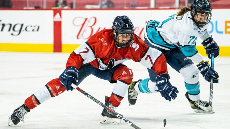 Team Scotiabank forward Samantha Cogan (7) skates ahead of Team Sonnet's Ella Matteucci (71) during the Professional Women's Hockey Players Association (PWHPA) Secret Dream Gap Tour. (HO, Dave Holland/PWHPA/CP)