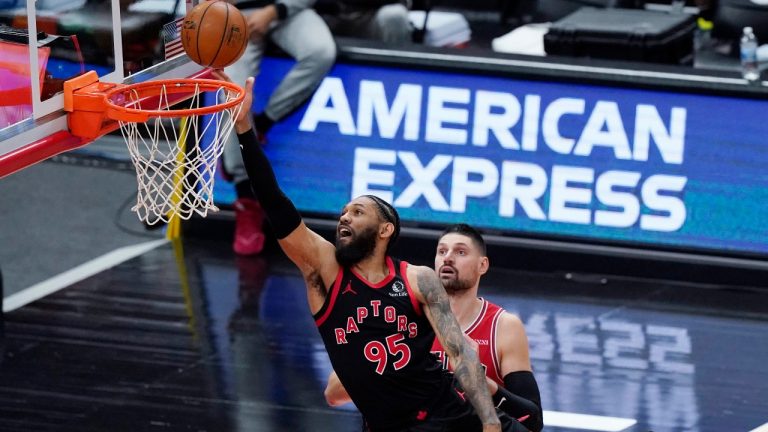 Toronto Raptors guard DeAndre' Bembry (95) drives to the basket against Chicago Bulls center Nikola Vucevic during the first half of an NBA basketball game in Chicago, Thursday, May 13, 2021. (Nam Y. Huh/AP)