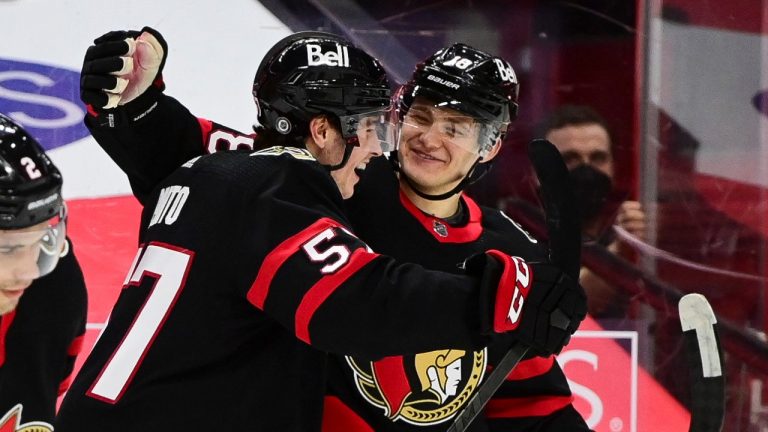 Ottawa Senators' Shane Pinto, left, celebrates a goal with teammate Tim Stützle against the Montreal Canadiens during first period NHL action in Ottawa on Wednesday, March 5, 2021. Sean Kilpatrick/ THE CANADIAN PRESS